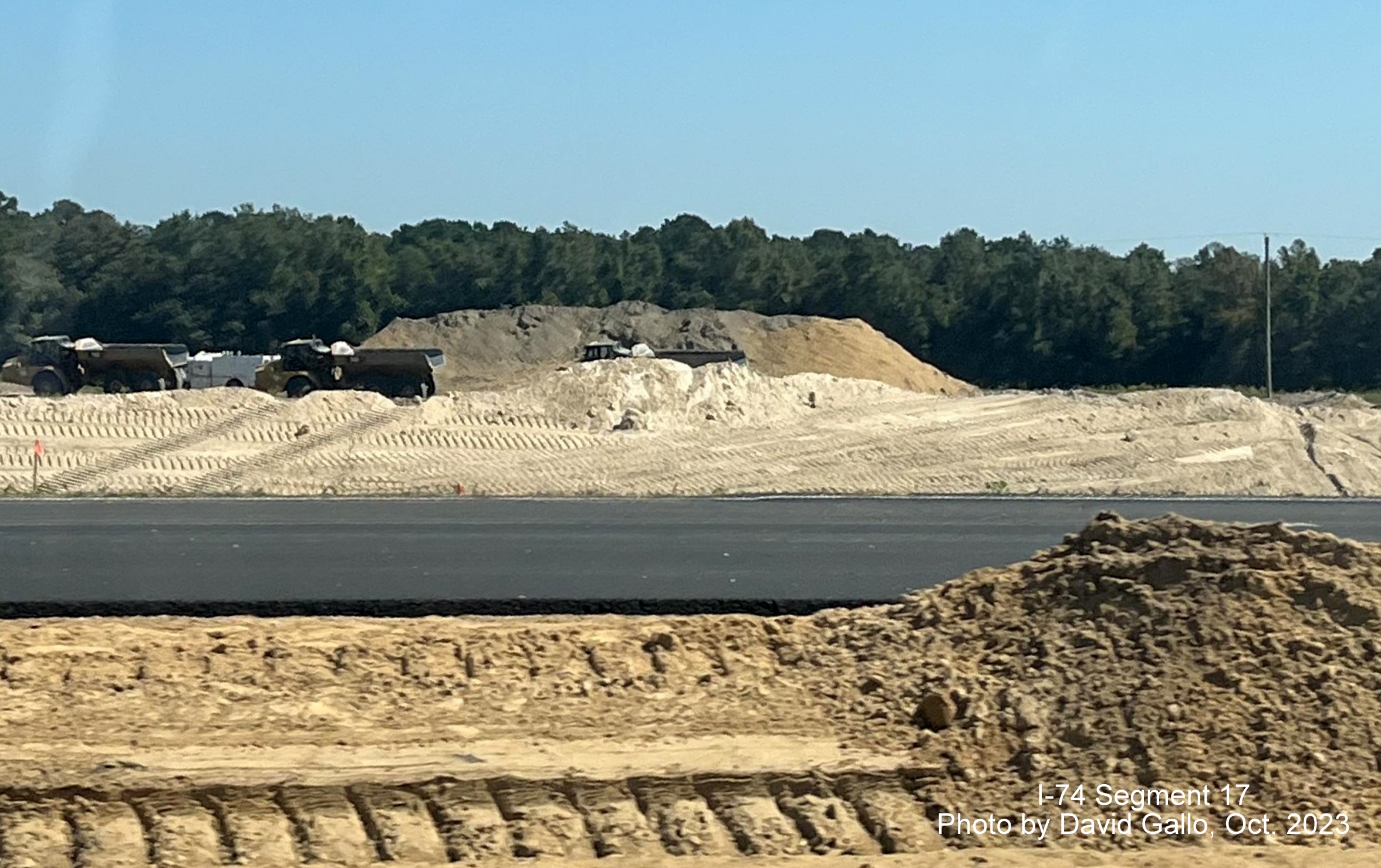 Image of construction near NC 72 intersection on US 74 West near Boardman from eastbound lanes 
       in interchange construction area, by David Gallo, October 2023