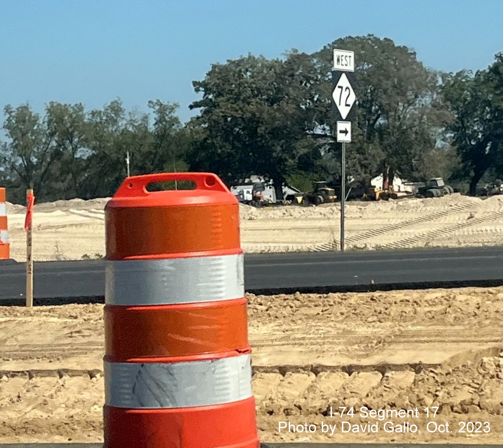 Image of West NC 72 trailblazer near intersection on US 74 West near Boardman as seen from
       eastbound lanes in interchange construction area, by David Gallo, October 2023