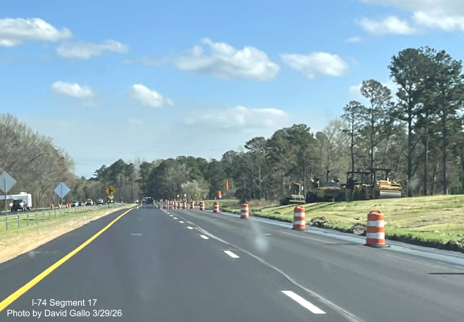 Image approaching the current 130 West intersection from US 74 (Future I-74) East 
	  in Robeson County showing paving equipment sitting on the unopened ramp. Google Maps Street View, February 2026