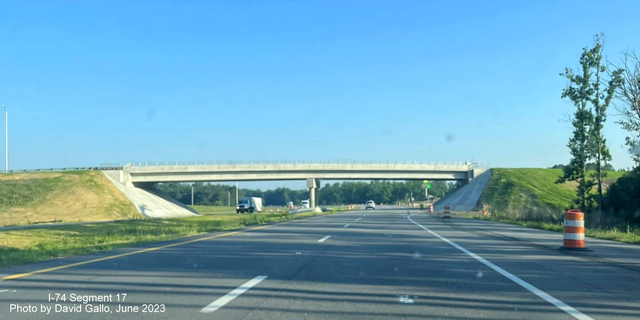 Image of finished US 74 (Future I-74) West roadway heading under Old Boardman Road bridge, by 
        David Gallo, June 2023