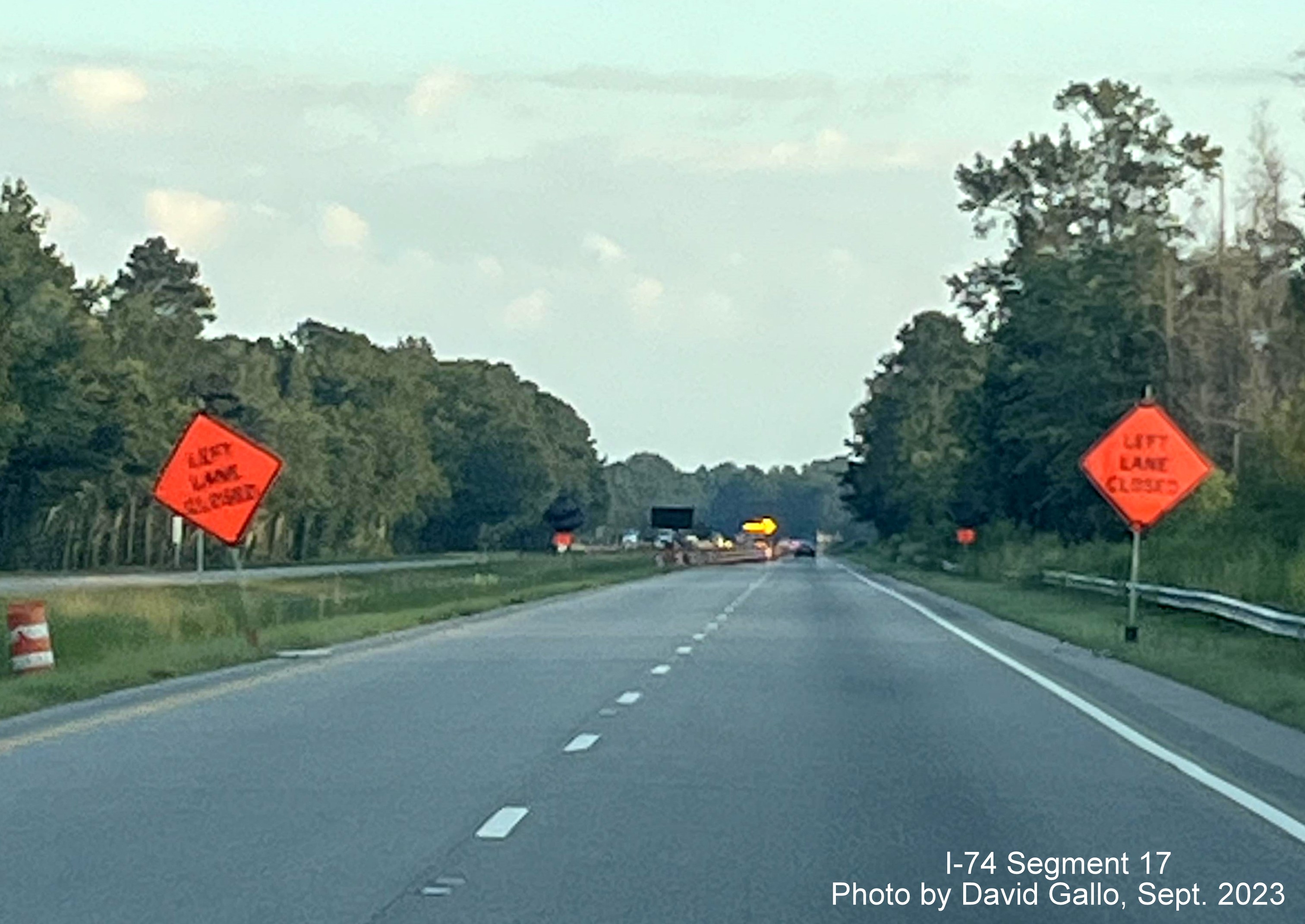 Image of signs warning of approaching left lane closure approaching the NC 72 intersection on 
         US 74 West in interchange project work zone, David Gallo, September 2023