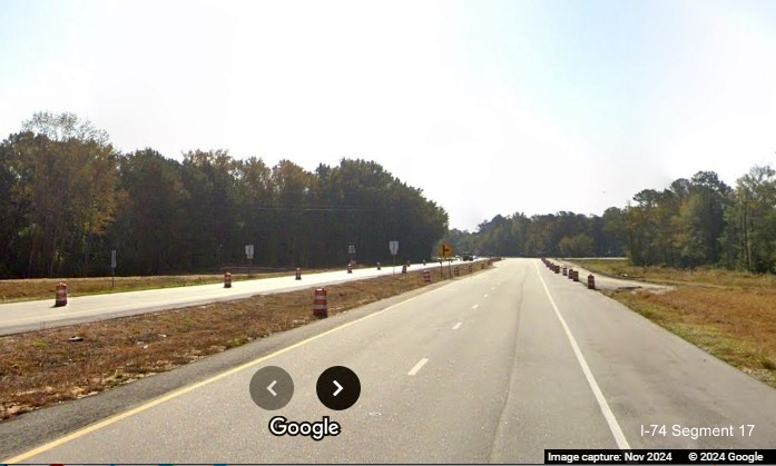 Image approaching future exit on-ramp prior to current NC 130 intersection on US 74 (Future I-74) East 
        near Boardman, Google Maps Street View, November 2024