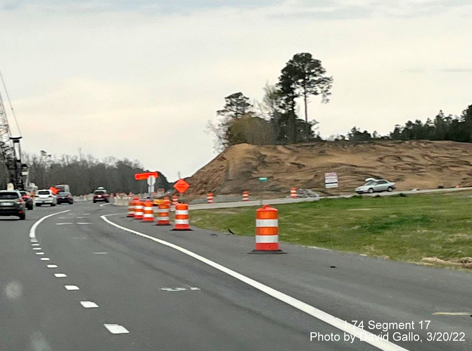 Image of embankment being built for future Old Boardman Road bridge over US 74 (Future I-74), 
        by David Gallo, March 2022