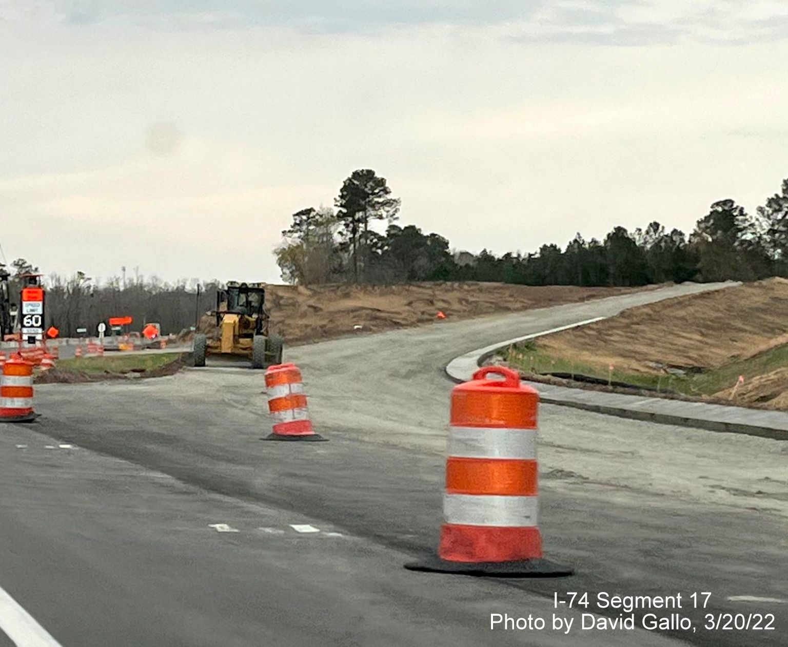 Image of future exit ramp for future Old Boardman Road from US 74 (Future I-74) East, 
        by David Gallo, March 2022