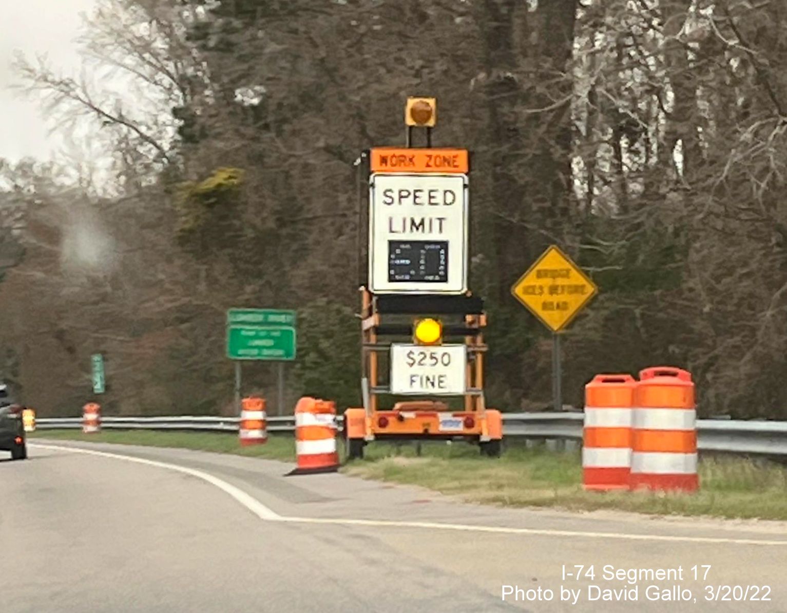 Image of temporary speed limit sign approaching Lumber River bridge on US 74 (Future I-74) East, 
        by David Gallo, March 2022