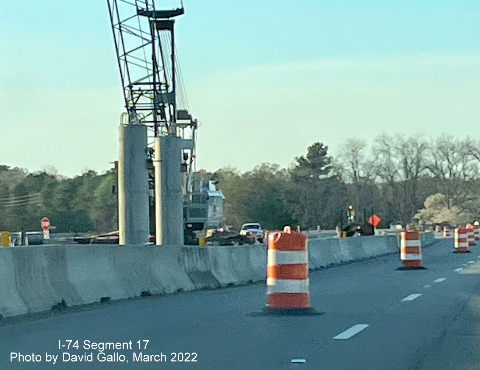 Image of closeup of crane helping construct supports for future Boardman interchange bridge on US 74 (Future I-74) West
        , by David Gallo, March 2022