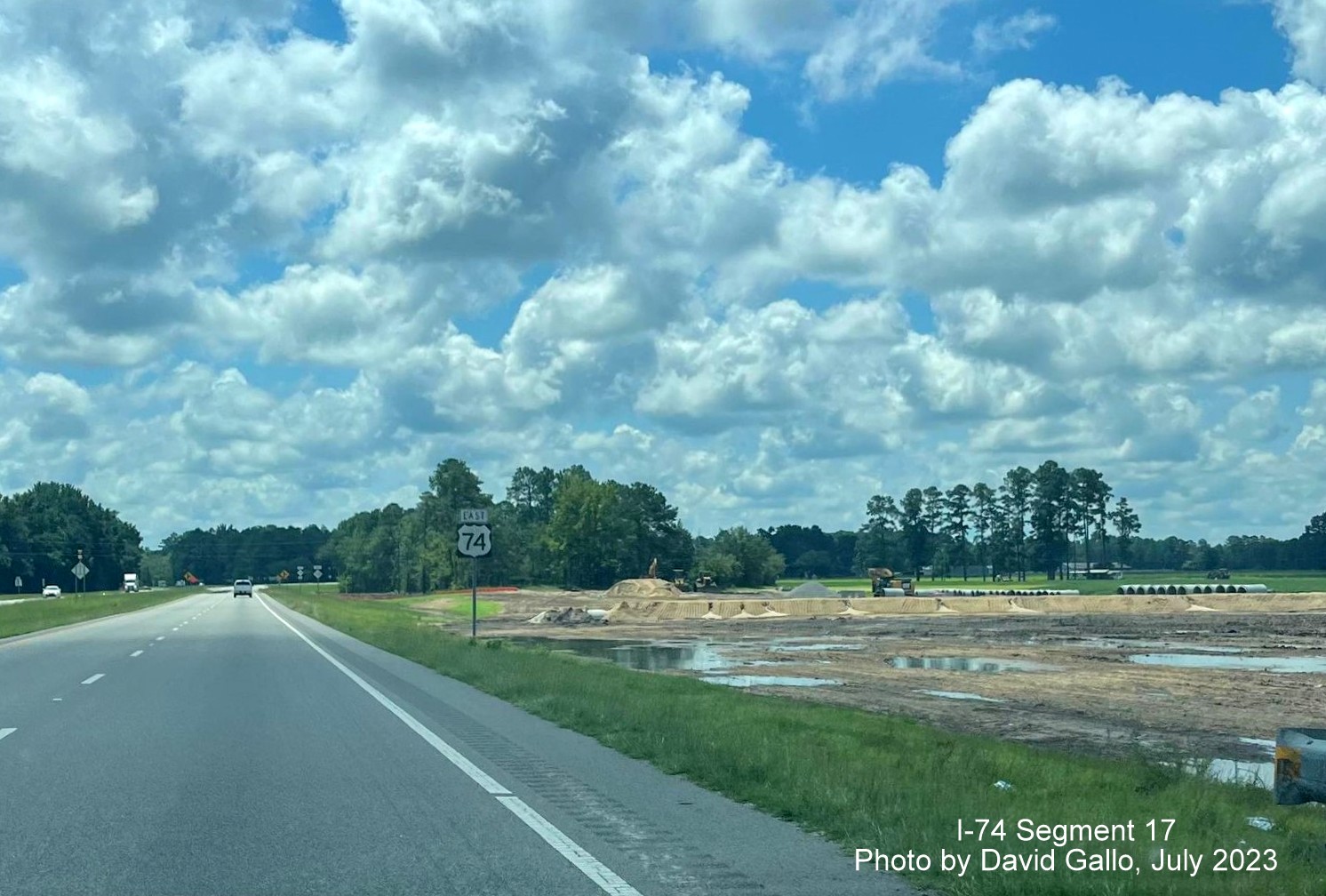 Image of land clearing along US 74 East lanes prior to NC 130 intersection for new interchange work, David Gallo, 
        July 2023