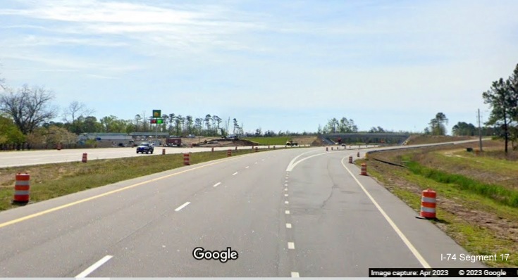Image of approaching completed exit ramp to Old Boardman Road on US 74/NC 130 East, Google Maps 
        Street View image, April 2023