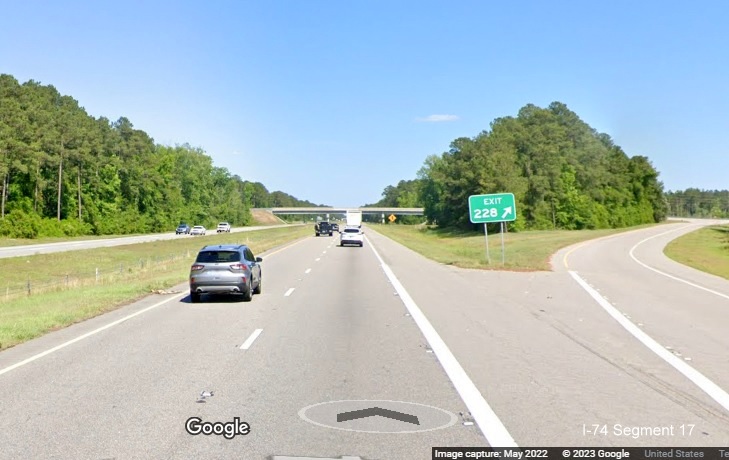 Image of gore sign for NC 242 exit on US 74 (Future I-74) East in 
        Columbus County, Google Maps Street View image, May 2022