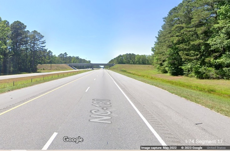 Image of ground mounted 3/4 mile advance sign for NC 242 exit on US 74 (Future I-74) East in 
        Columbus County, Google Maps Street View image, May 2022