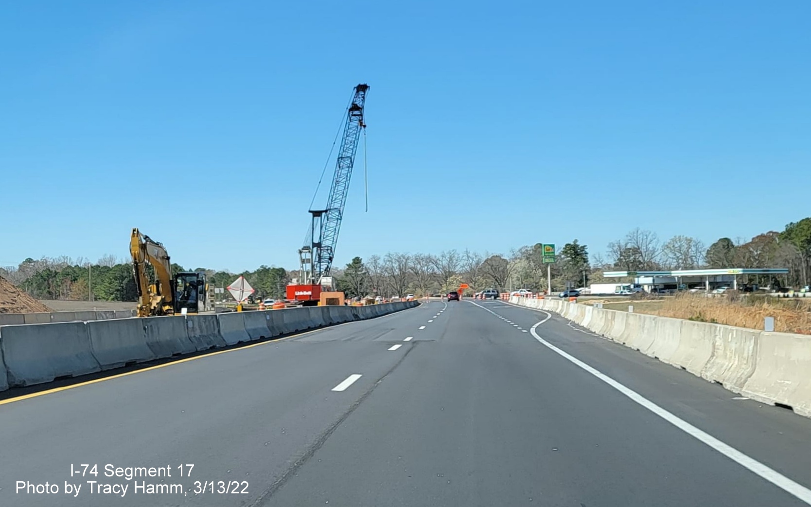 Image of construction crane building future Old Boardman Road bridge over US 74 West (Future I-74), 
        by Tracy Hamm, March 2022