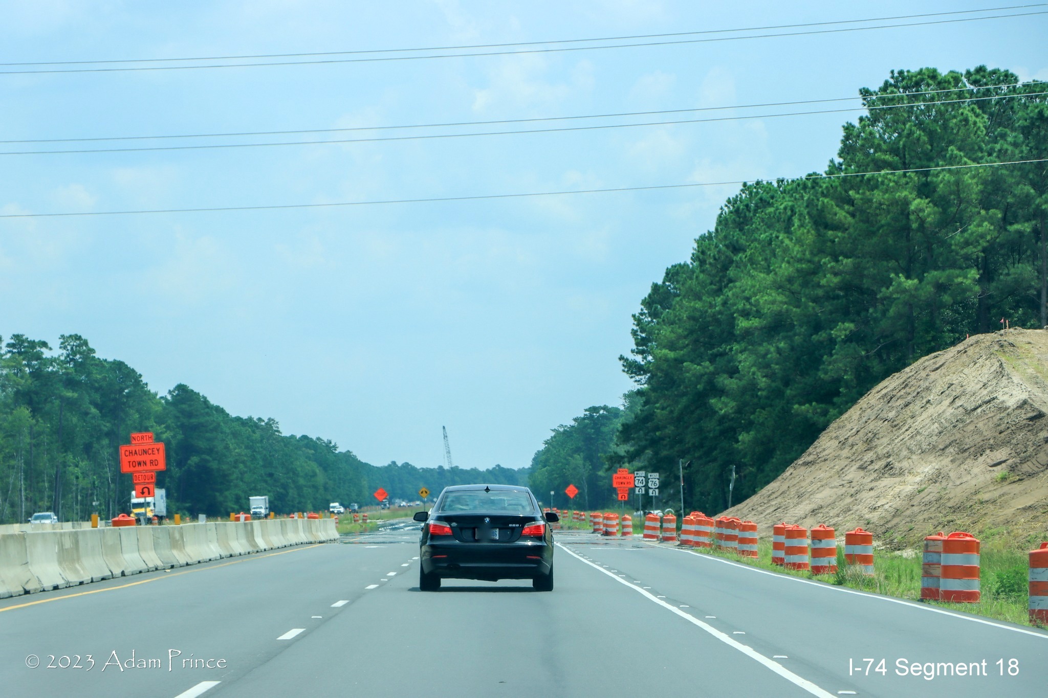 Image of US 74/76 East traffic traveling through future Chauncey Town Road interchange construction zone in Lake Waccamaw, Adam Prince July 2023