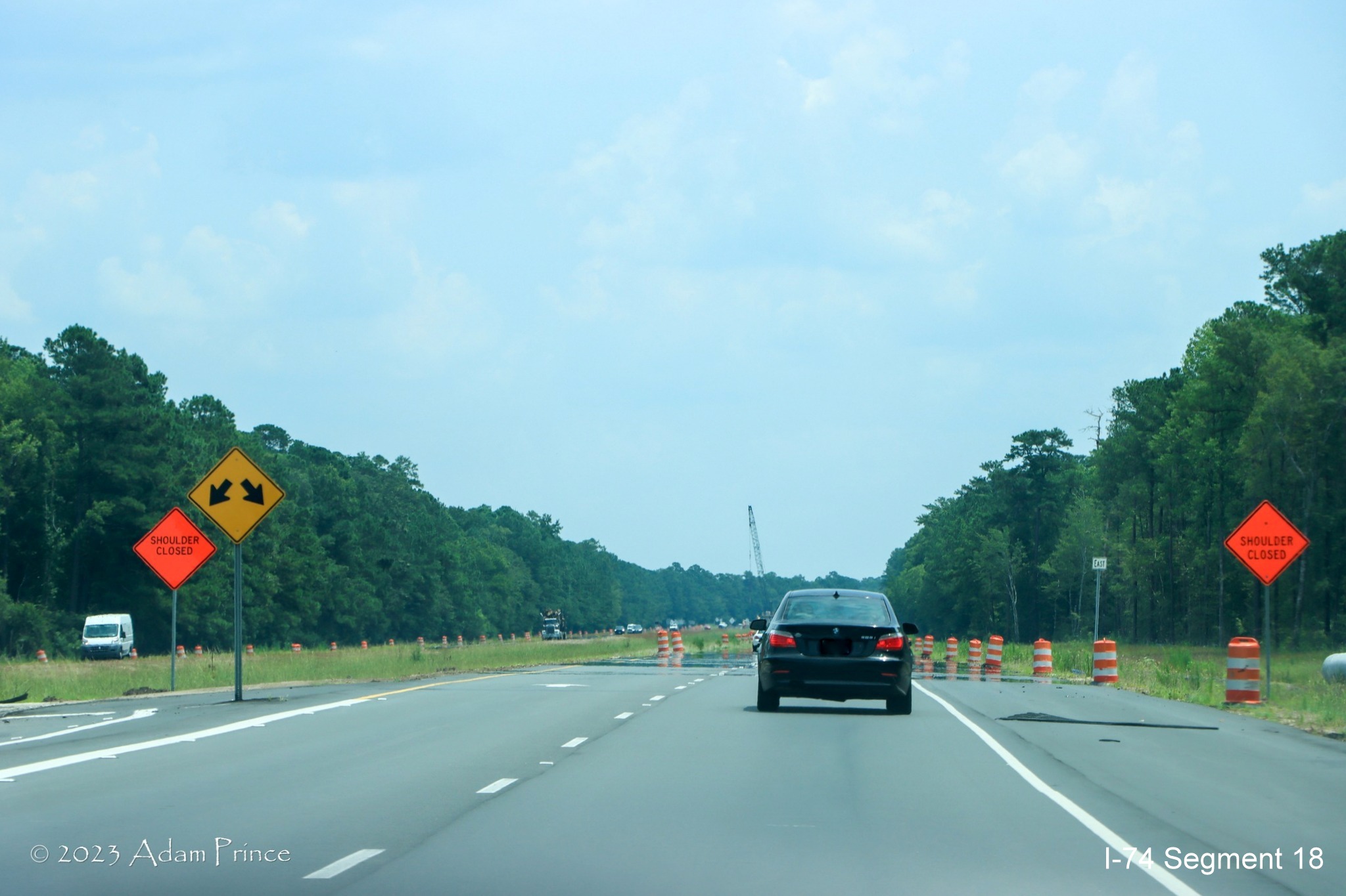 Image of US 74/76 East traffic traveling through future Chauncey Town Road interchange construction zone in Lake Waccamaw, Adam Prince July 2023