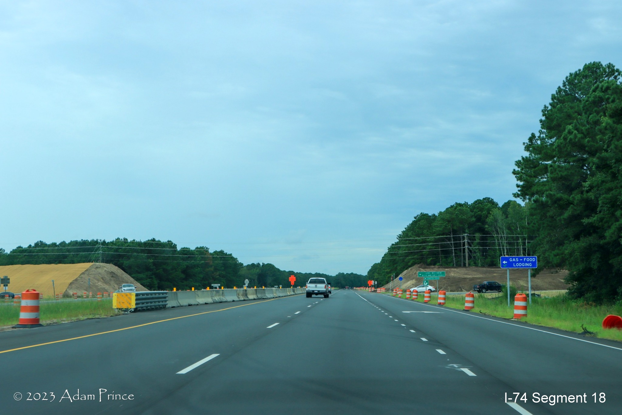Image of US 74/76 West traffic traveling through future Chauncey Town Road interchange construction zone in Lake Waccamaw, Adam Prince July 2023