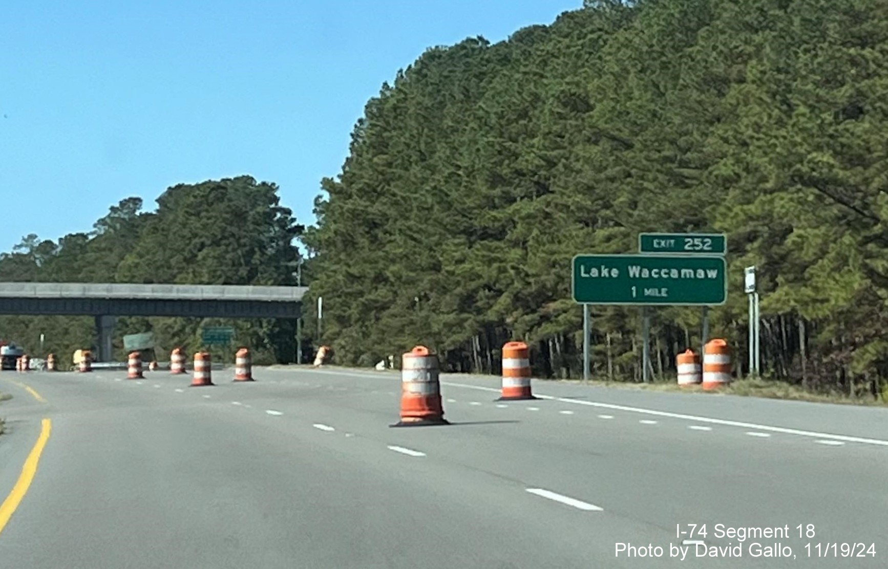 Image of new 1 Mile advance sign for Lake Waccamaw exit on US 74/76 (Future I-74) 
       West, by David Gallo, November 2024