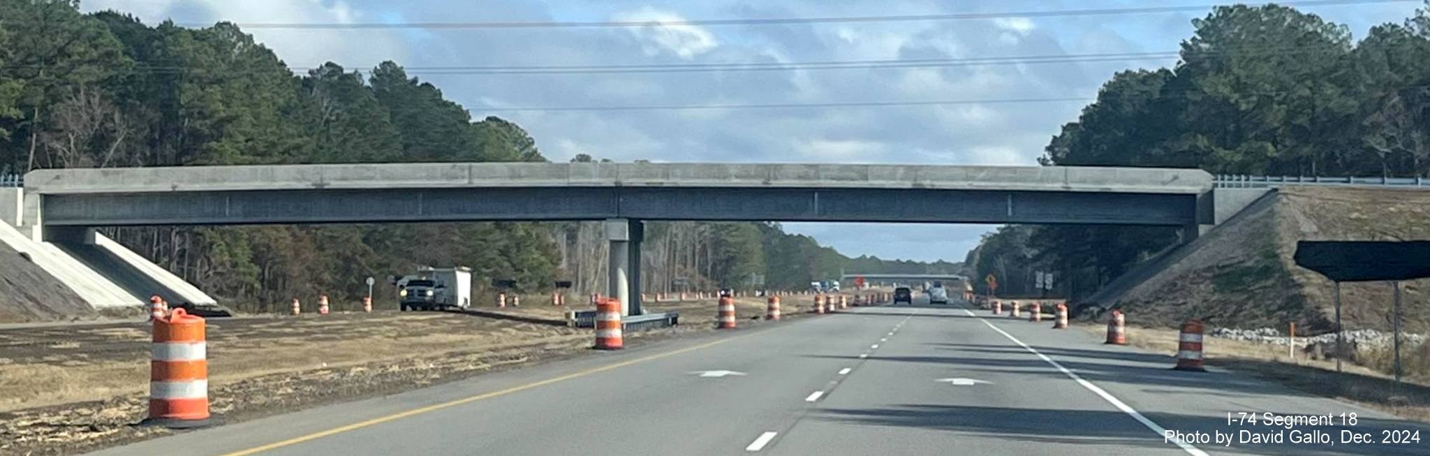 Image of nearly completed Old Lake Road bridge over US 74/76 (Future I-74) East in Lake Waccamaw, 
      by David Gallo, December 2024