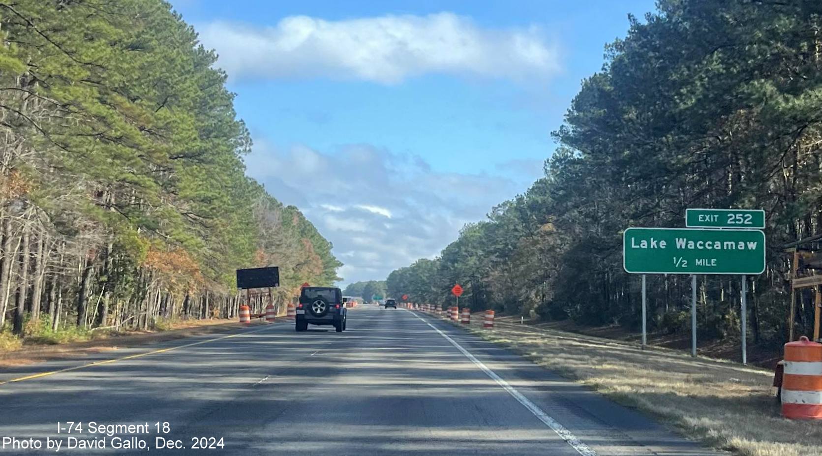 Image of recently placed 1/2 mile advance sign for new Lake Waccamaw exit on US 74/76 (Future I-74) East in Columbus County, by David Gallo, December 2024