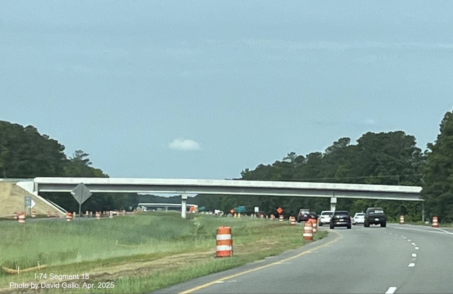 Image of recently placed ground mounted ramp and gore sign for new Lake Waccamaw exit on US 74/76 (Future I-74)
          East in Columbus County, by David Gallo, December 2024