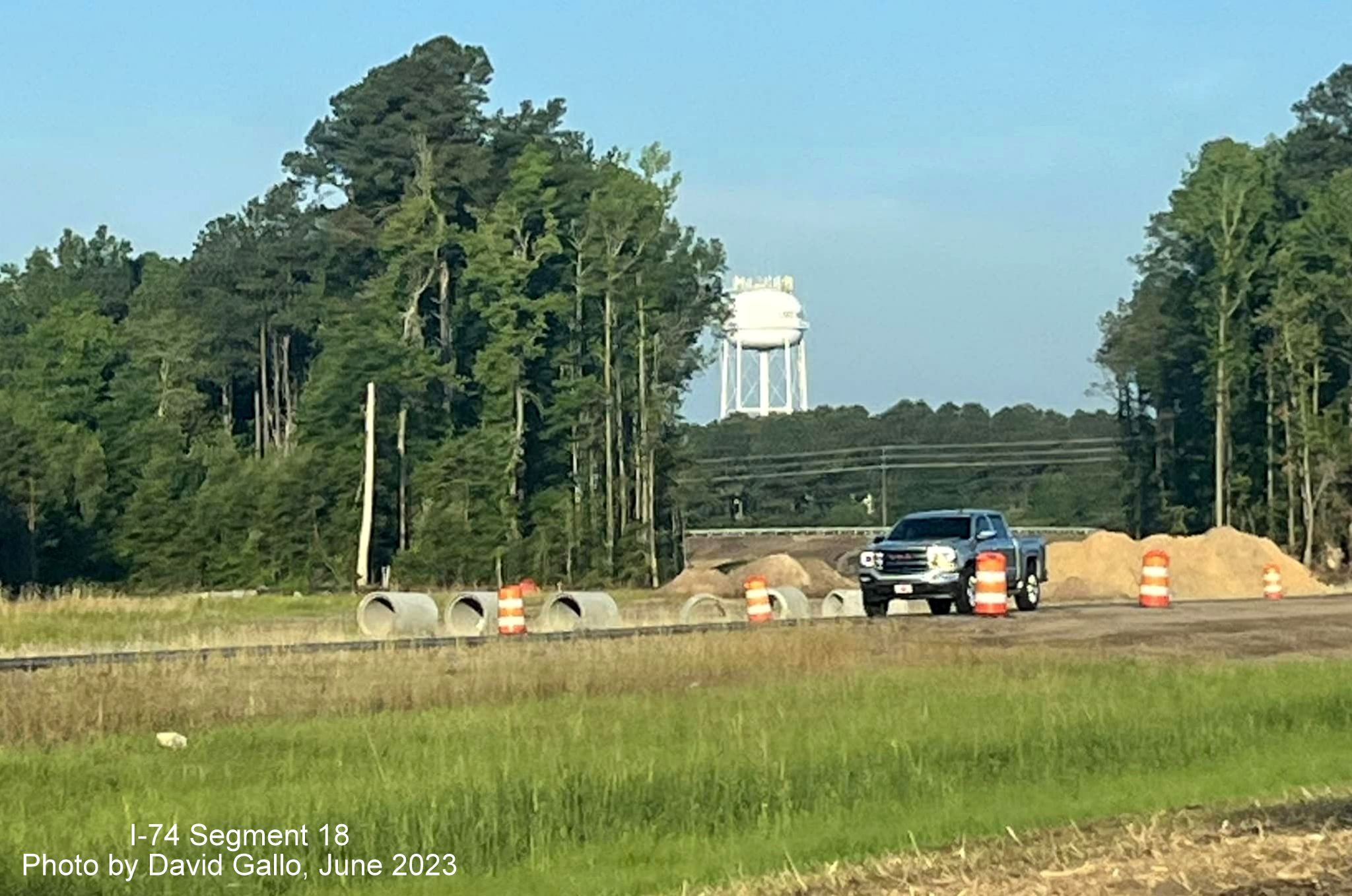 Image of construction of future interchange on-ramp to US 74/76 West from Chauncey Town Road 
        in Lake Waccamaw, by David Gallo, June 2023