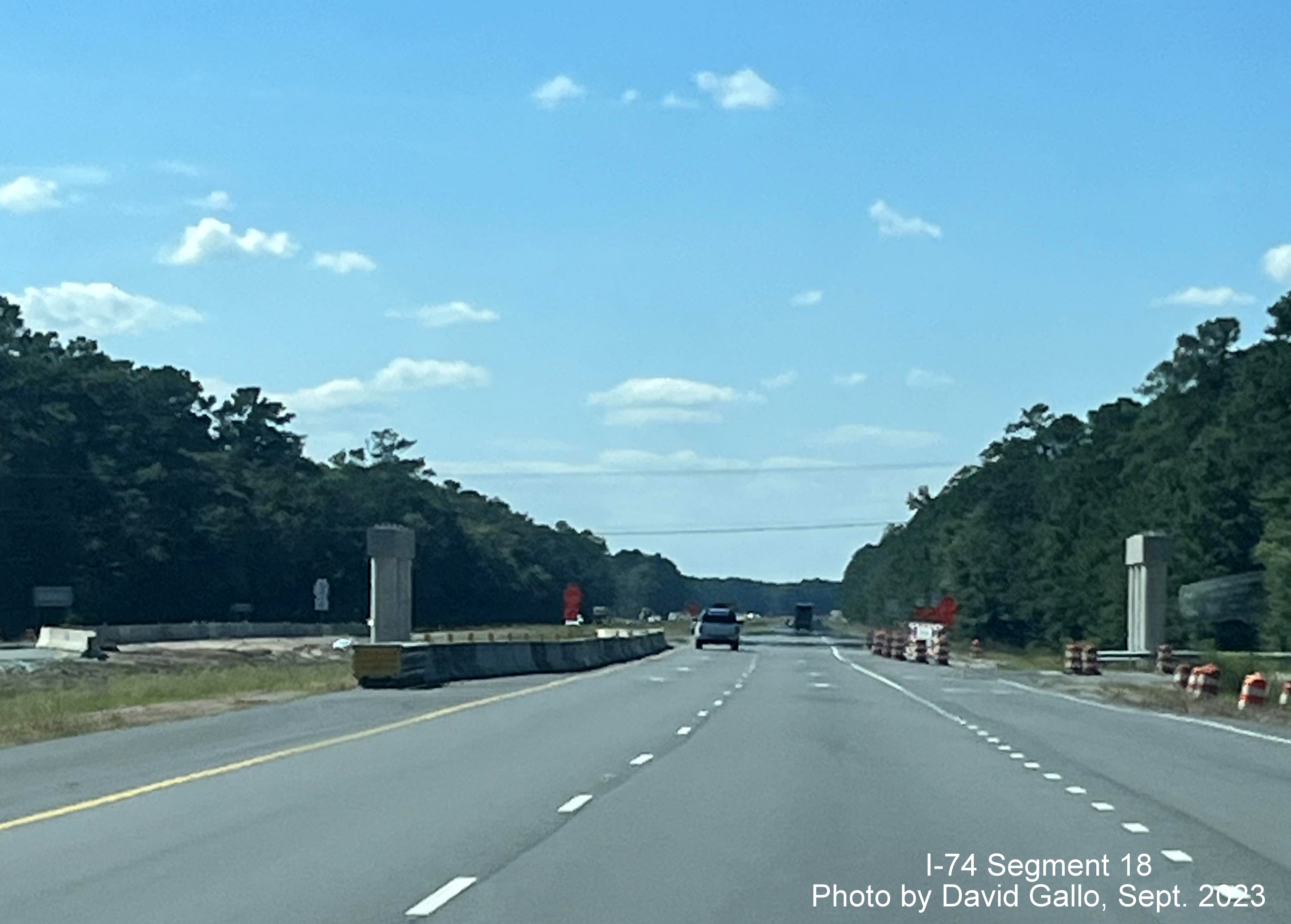 Image of the bridge supports at site of current Old Lake Road intersection on US 74/76 (Future I-74) West in Lake Waccamaw, David Gallo, September 2023