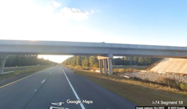 Image of heading under the completed Lake Road bridge on US 74/76 (Future I-74) West 
	  in Lake Waccamaw, Google Maps Street View, October 2025