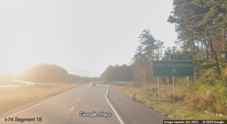 Image of ground mounted ramp sign for Lake Waccamaw exit on US 74/76 (Future I-74) West, 
	  Google Maps Street View, October 2025