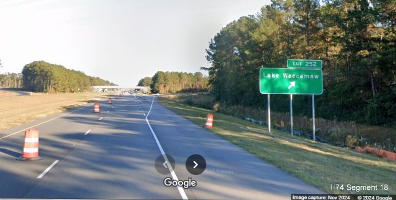 Image of recently placed ramp sign for Lake Waccamaw exit on US 74/76 (Future I-74) East, Google 
        Maps Street View, November 2024