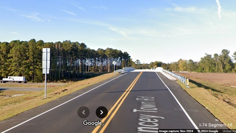 Image of approaching recently opened bridge for Lake Waccamaw exit over US 74/76 (Future I-74), 
        Google Maps Street View, November 2024