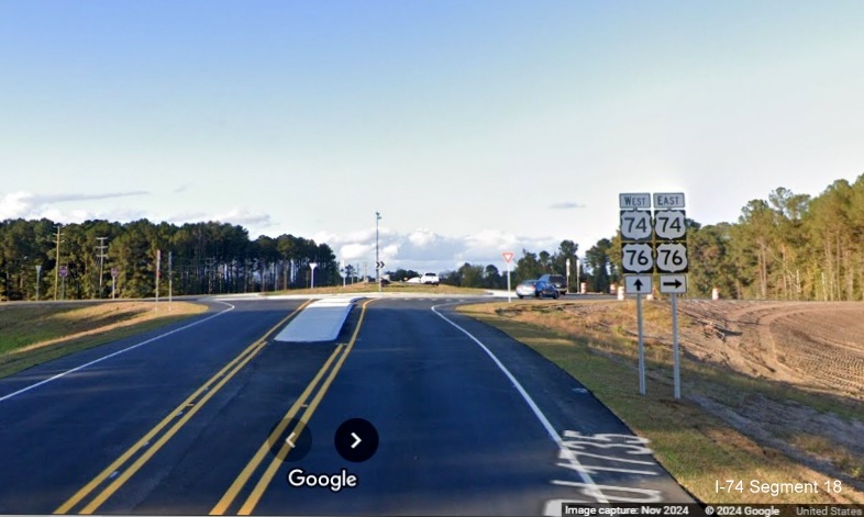 Image of approaching the new roundabout for the Lake Waccamaw exit on Chauncey Town Road at the 
        ramps for US 74/76 (Future I-74) East, Google Maps Street View, November 2024