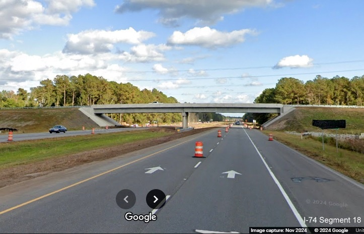 Image of approaching recently opened bridge for Lake Waccamaw exit over US 74/76 (Future I-74), 
        Google Maps Street View, November 2024