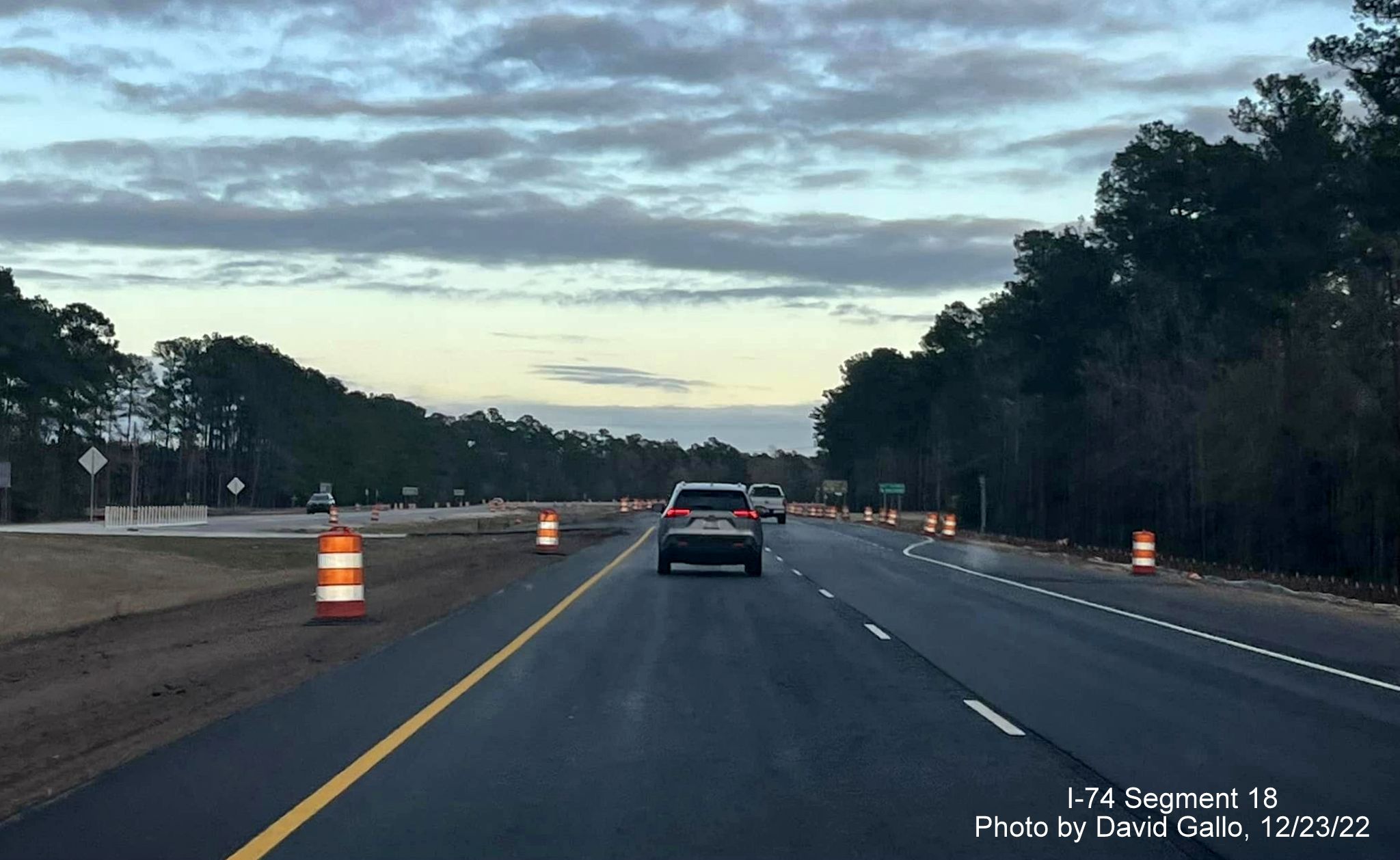 Image of approaching the Old Lake Road intersection in Lake Waccamaw interchange work zone on US 74/76 East, by David Gallo, December 2022