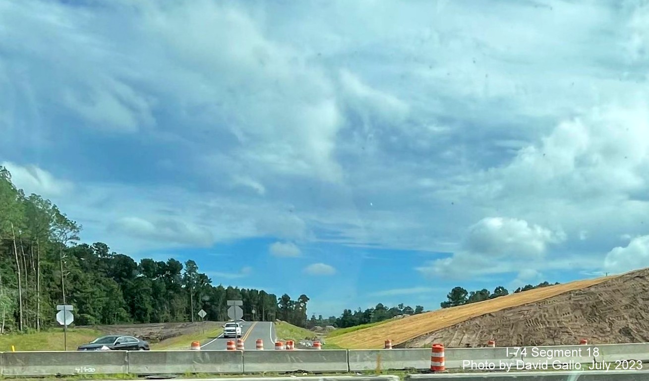 Image of current Chauncey Town Road intersection with US 74/76 (Future I-74) West from eastbound roadway, David Gallo, July 2023