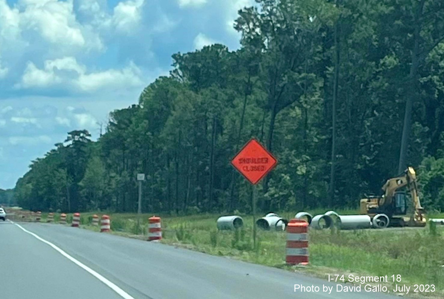 Image of construction equipment being stored prior to Old Lake Road in Lake Waccamaw on US 74/76 (Future I-74) East, David Gallo, July 2023