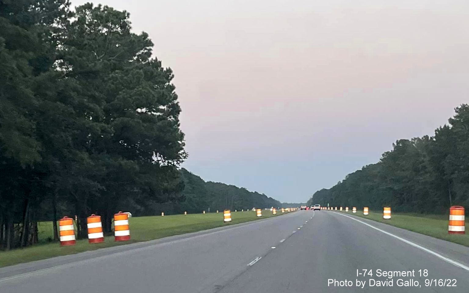Image of construction barrels along US 74 West prior to new Lake Waccamaw interchange construction zone, by David Gallo, September 2022
