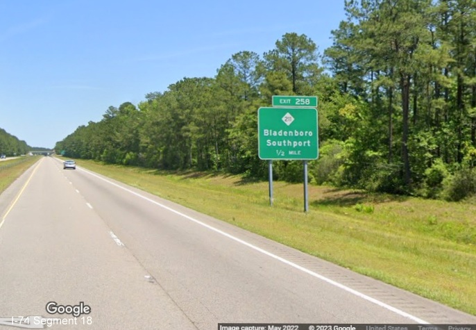 Image of ground mounted 1/2 mile advance sign for NC 211 exit on US 74/76 (Future I-74) East in Supply, Google Maps Street View image, May 2022