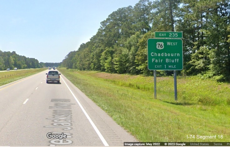 Image of ground mounted 1 mile advance sign for the US 76 West exit on the US 74/76 Whiteville Bypass, Google Maps Street View image, May 2022