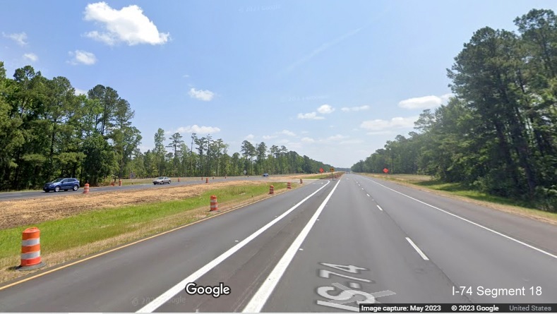 Image of reduced conflict intersection turn around for US 74/76 West after the Chauncey Town Road
        intersection in Lake Waccamaw on US 74/76 East, Google Maps Street View, May 2023