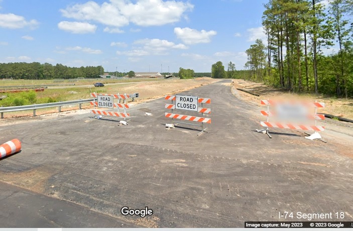 Image of construction of a temporary roadway for Old Lake Road to detour traffic from bridge
        construction as part of the Lake Waccamaw interchange project along US 74/76 West, Google Maps Street View, May 2023