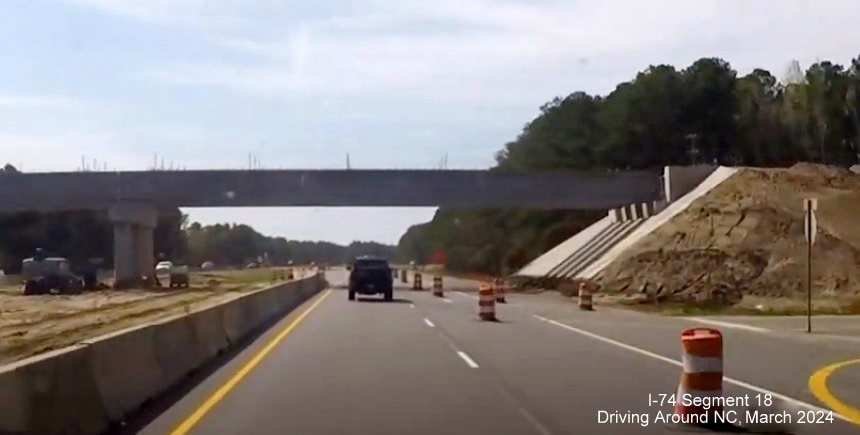 Image of future Chauncey Town Road bridge at Lake Waccamaw interchange, screen shot from 
        video by Driving Around NC, April 2024