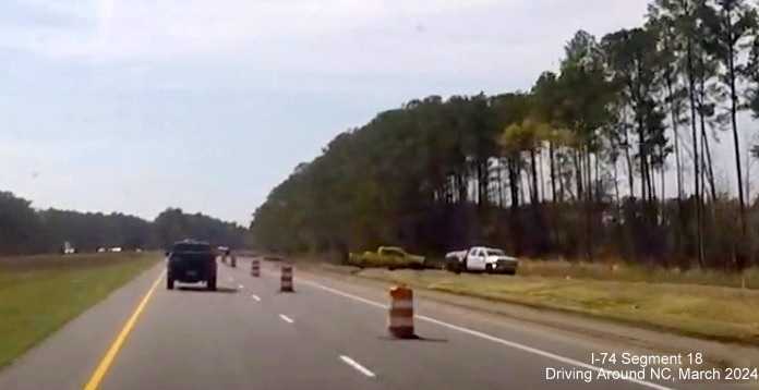 Image of the future on-ramp from the Lake Waccamaw interchange on US 74/76 (Future I-74) West, screen 
        shot from video by Driving Around NC, April 2024