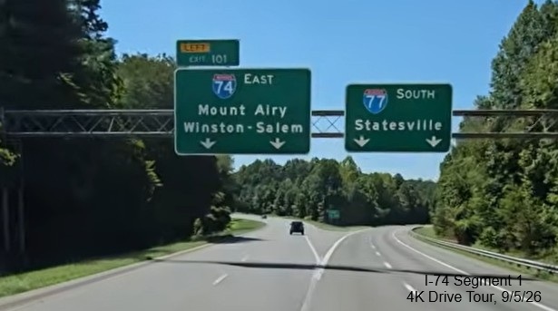 Image of unchanged exit number for I-74 East exit on overhead signage on I-77 
	  South in Surry County, Screen grab from 4K Drive Tour video, September 2026