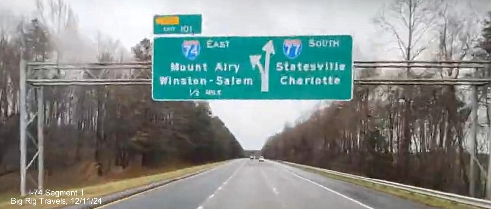 Image of 1/2 Mile advance overhead sign for East I-74/South I-77 ramp split, showing no change in
        exit numbers heading south in Surry County, Google Maps Street View image, December 2024