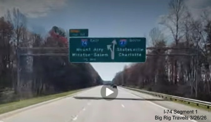 Image of unchanged exit number for I-74 East exit on overhead signage on I-77 
	  South in Surry County, Screen grab from Big Rig Travels video, March 2026