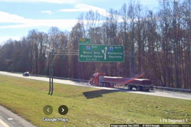 Image of unchanged exit number for I-74 East exit on overhead signage on I-77 South
in Surry County, Google Maps Street View, December 2025