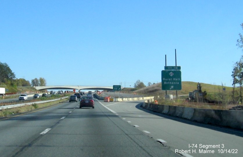 Image of signage on US 52 South for the NC 65 exit approaching the future 
       I-74/Winston-Salem Northern Beltway interchange in Rural Hall, October 2022