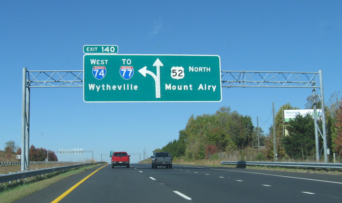 Photo of new overhead signage placed at I-74 West Exit from US 52