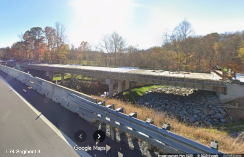 Image of Toms Creek bridge construction in Surry County from temporary US 52
	  South lanes, Google Maps Street View, November 2025
