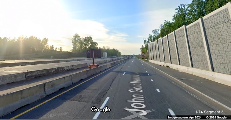 Image of traffic on US 52 North at end of future C/D lane from Winston-Salem Northern Beltway 
       interchange separated from current US 52 South traffic using future US 52 North lanes, Google Maps Street View, April 2024