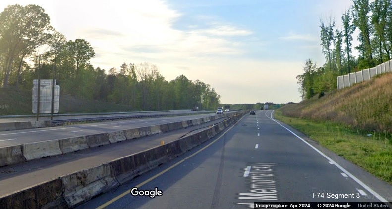 Image of traffic on US 52 North at end of future C/D lane from Winston-Salem Northern Beltway 
       interchange separated from current US 52 South traffic using future US 52 North lanes, Google Maps Street View, April 2024