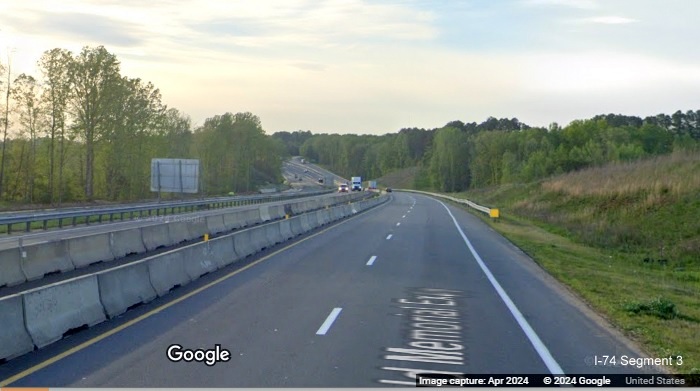 Image of traffic on US 52 North approaching the Westinghouse Road exit using 1/2 of 
        permanent lanes while other half is for current US 52 South traffic, Google Maps Street View, April 2024